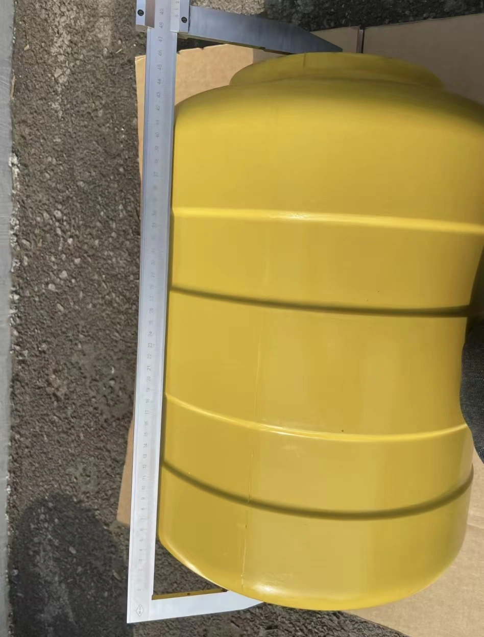 Overall dimensions of a yellow roller barrier component being checked with a caliper